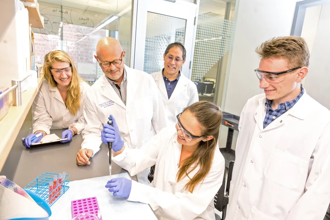 A photograph of researchers at BIO5 working in a lab