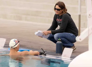 Trawick chats with coach Laura Utsch at a practice.